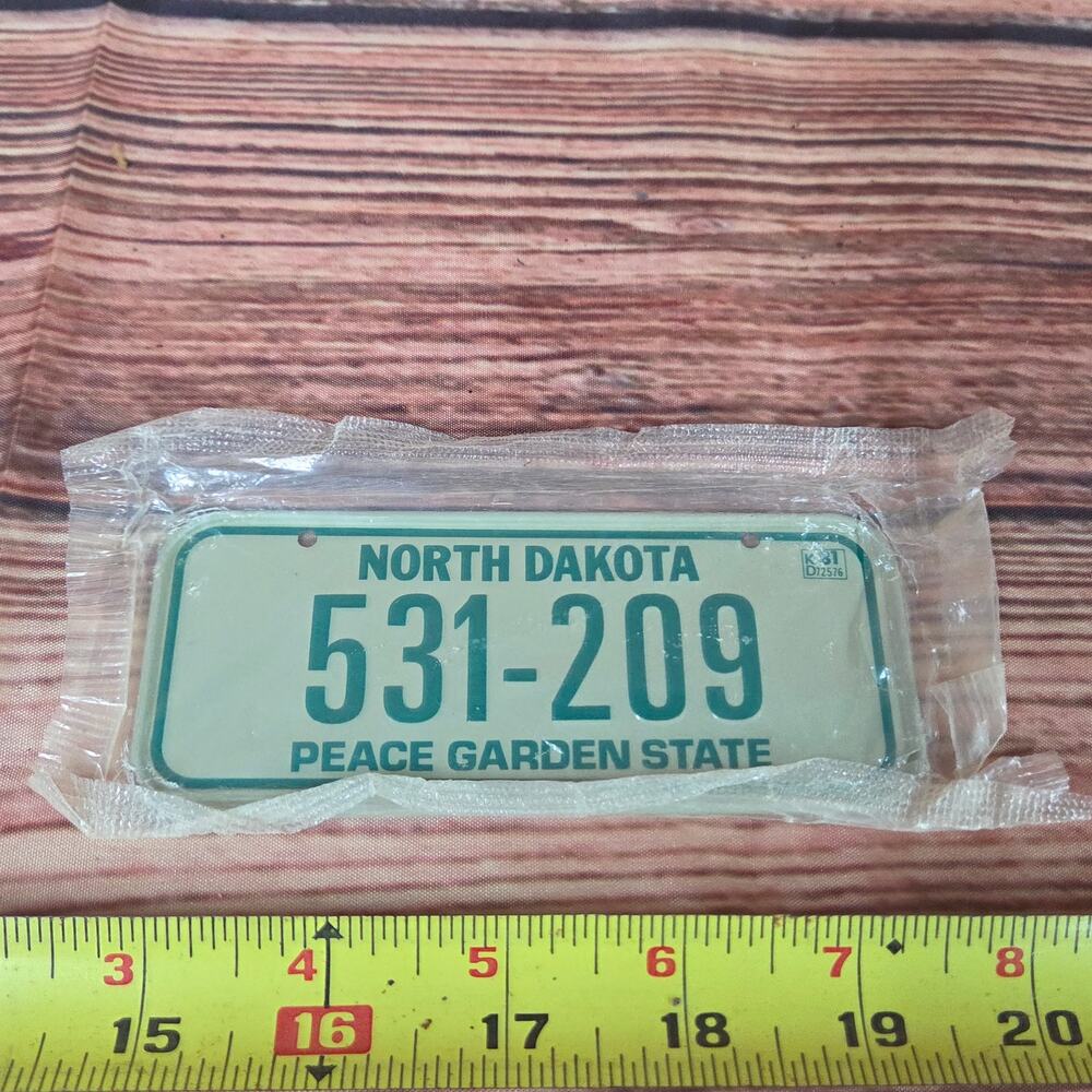 Vintage 1980s mini bicycle license plate North Dakota sealed